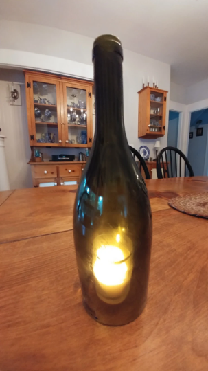 Wine bottle candle holder