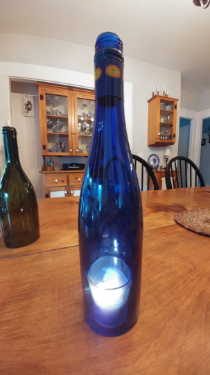 Wine bottle candle holder